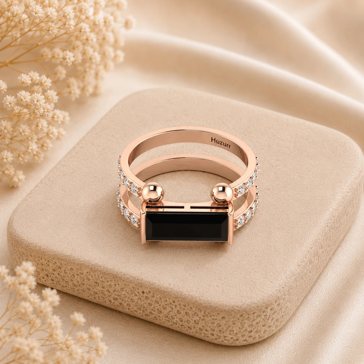 Baguette cut black diamond solitaire ring on a parallel split rose gold plated band with white diamond pave
