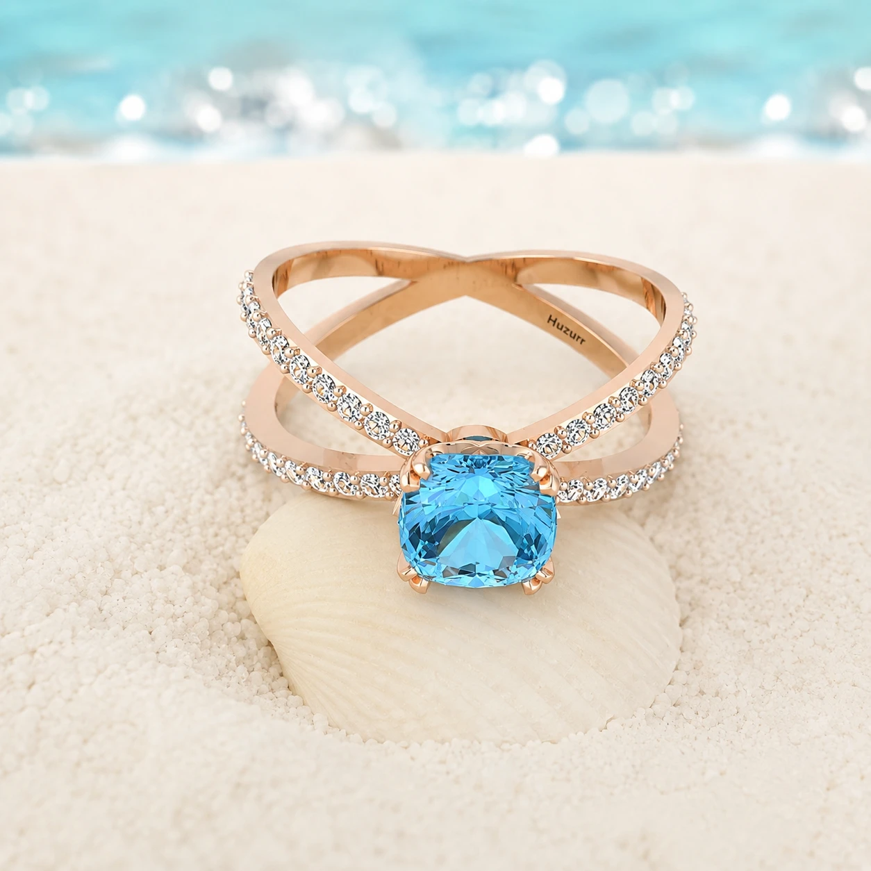Cushion-cut aquamarine solitaire ring on a rose gold-plated criss-cross split shank band set with small diamond