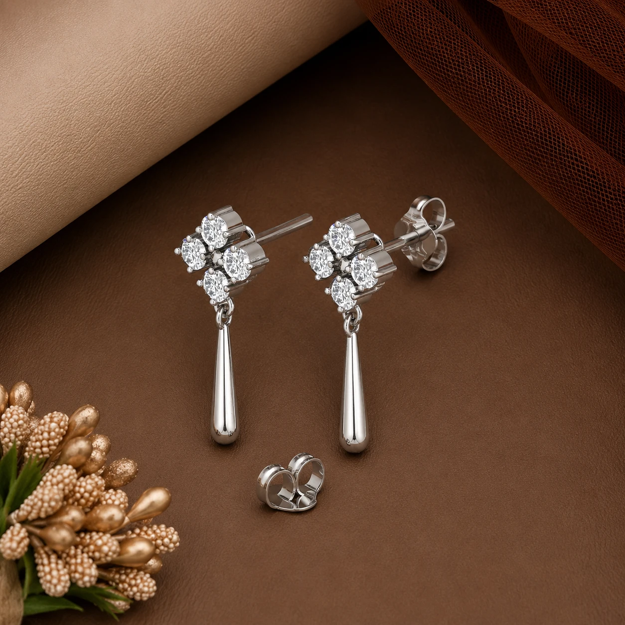 Movement-focused sterling silver drop earrings shimmering with elegant real diamond accents that catch the warm summer sunlight