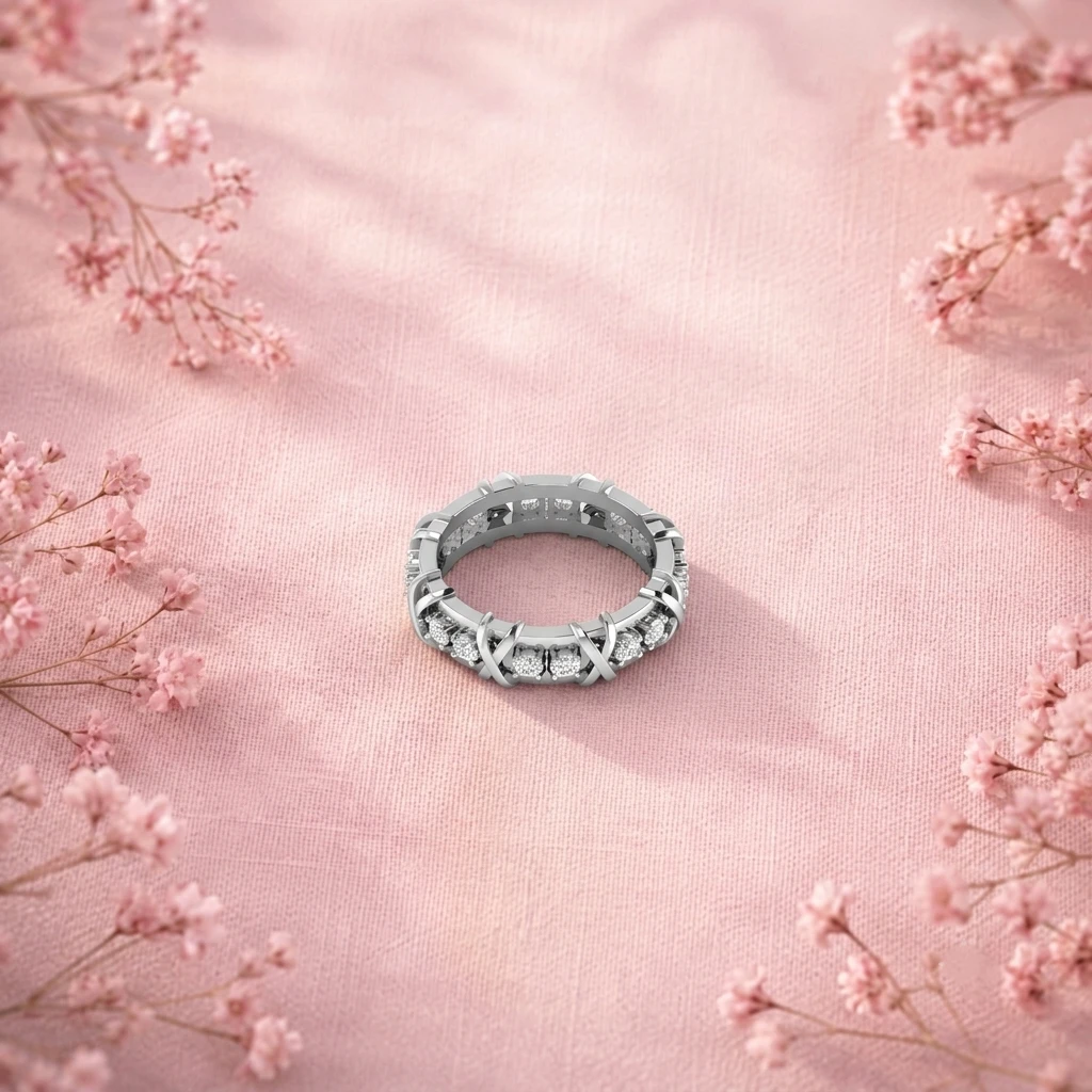 Silver criss-cross accent band ring studded with round diamonds.