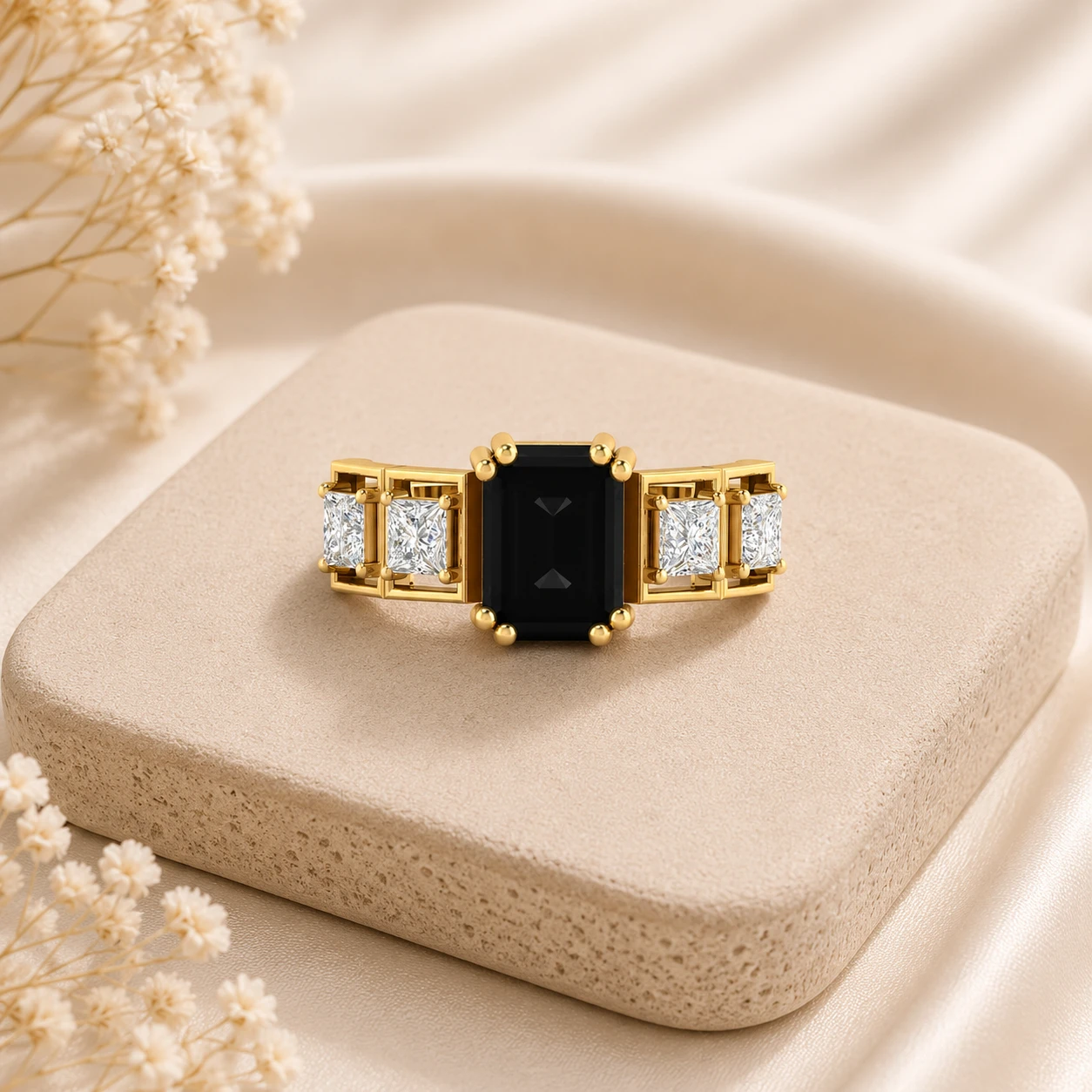 Emerald cut black diamond three stone ring with princess cut white side diamonds in yellow gold