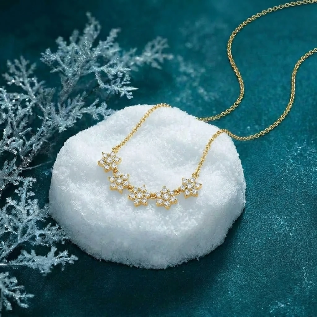 Five star-shaped diamond cluster pendant on a delicate yellow gold plated chain with snowfall-inspired sparkle