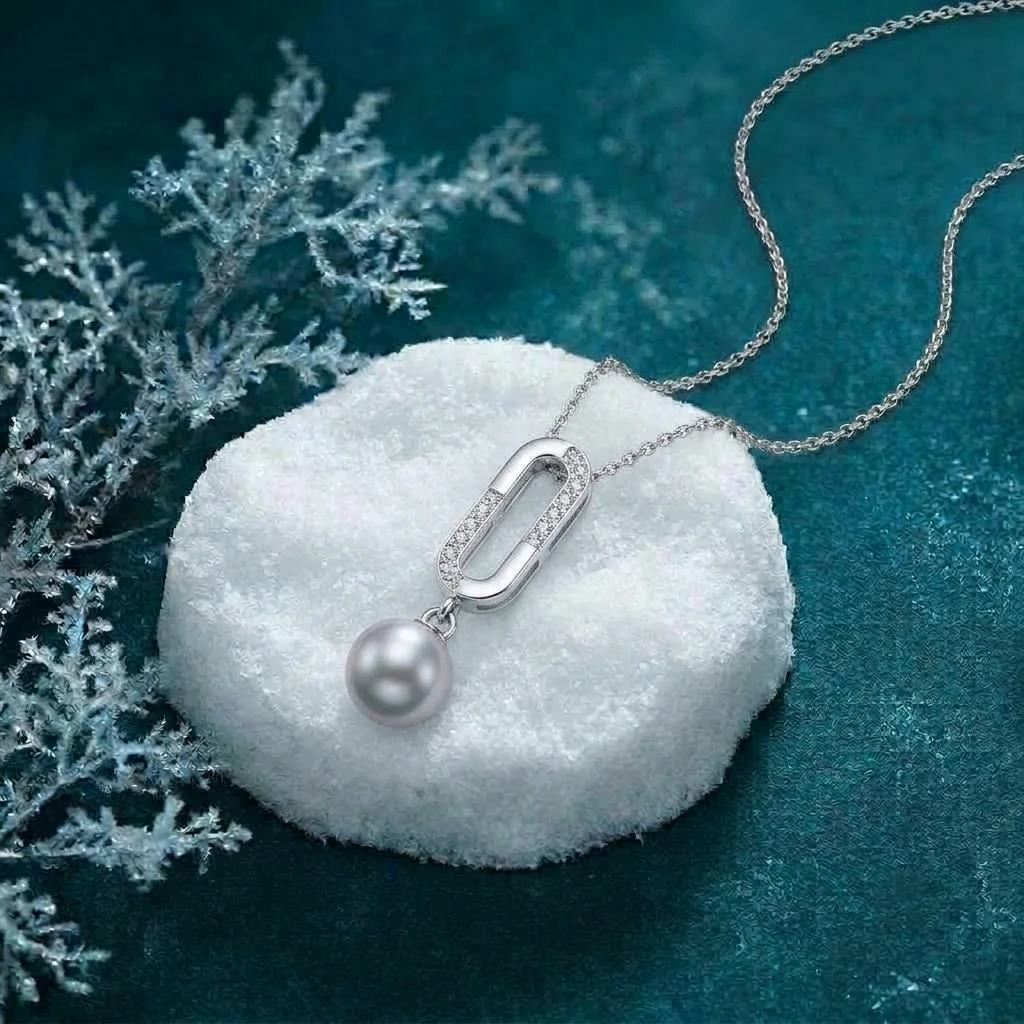 Silver drop necklace with a freshwater pearl and diamond-studded oval link for elegant Christmas style