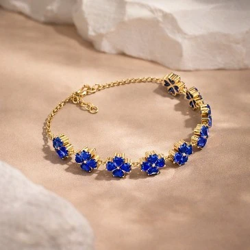 Lab-Created Blue Sapphire Heart Flower Chain Tennis Bracelet in gold plating