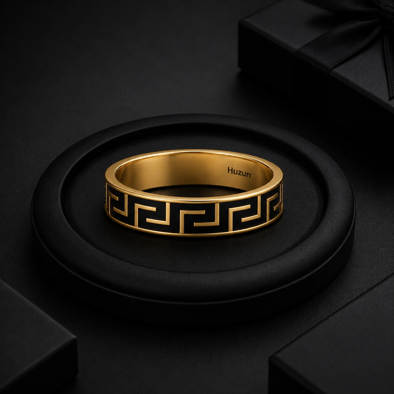 Greek key maze pattern band ring filled with bold black enamel on a gold-plated band