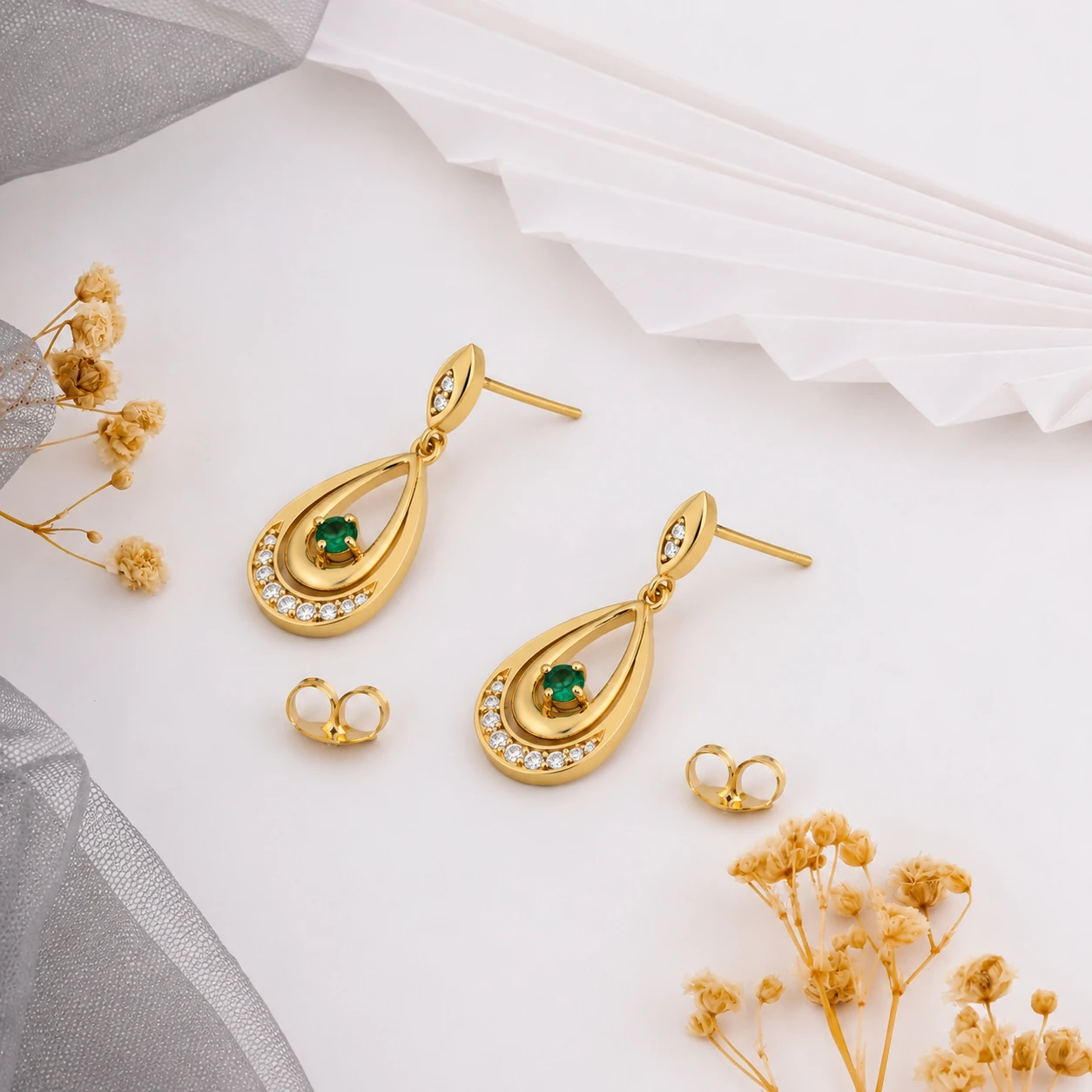 Teardrop earrings in gold plating with round green emeralds and diamond accents