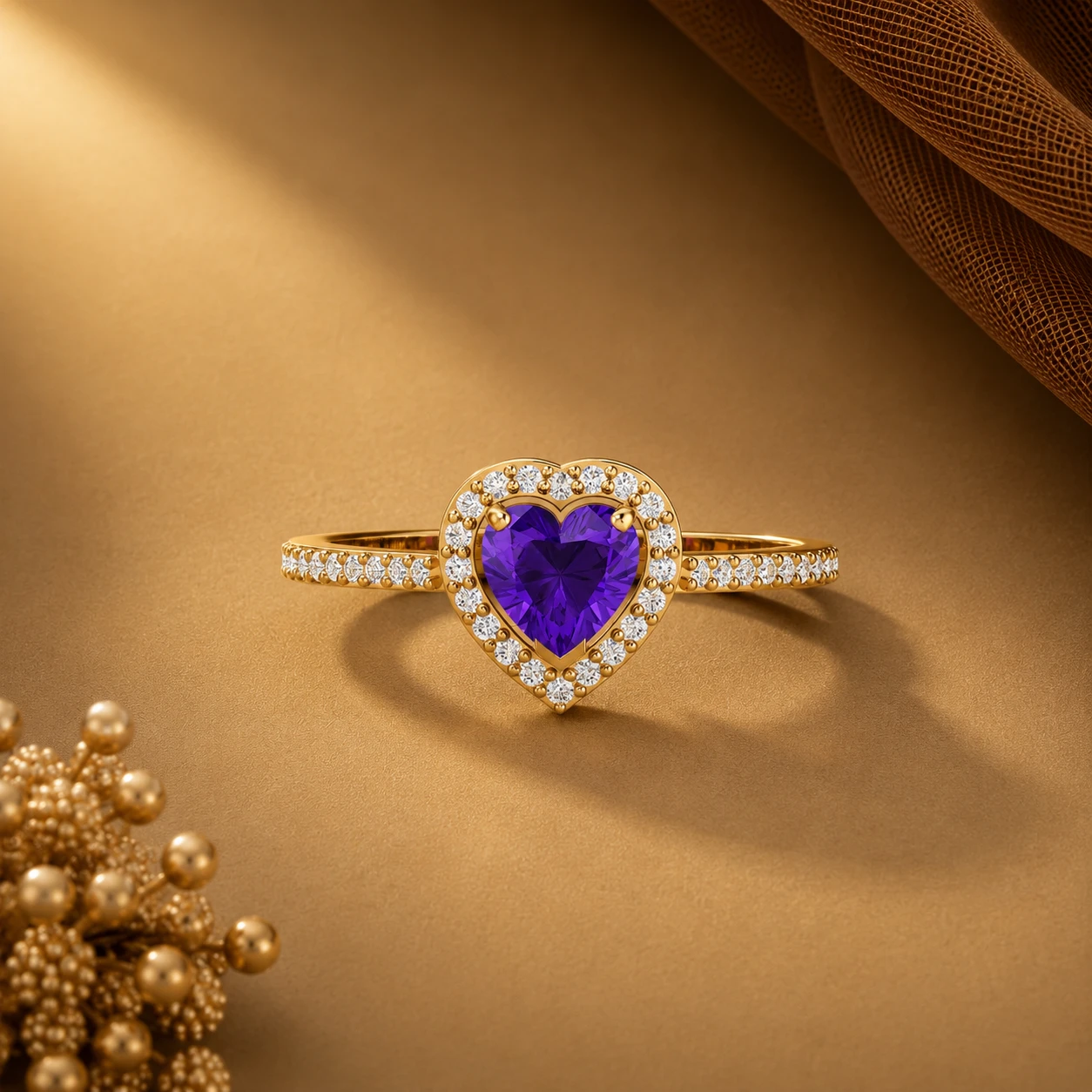 A gold-plated ring with a deep purple-heart-shaped amethyst gemstone surrounded by a halo of tiny diamonds.