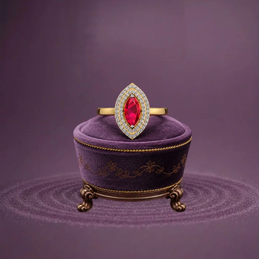 An elongated marquise-cut ruby ​​solitaire beautifully set on a modern gold-plated two-tone band.