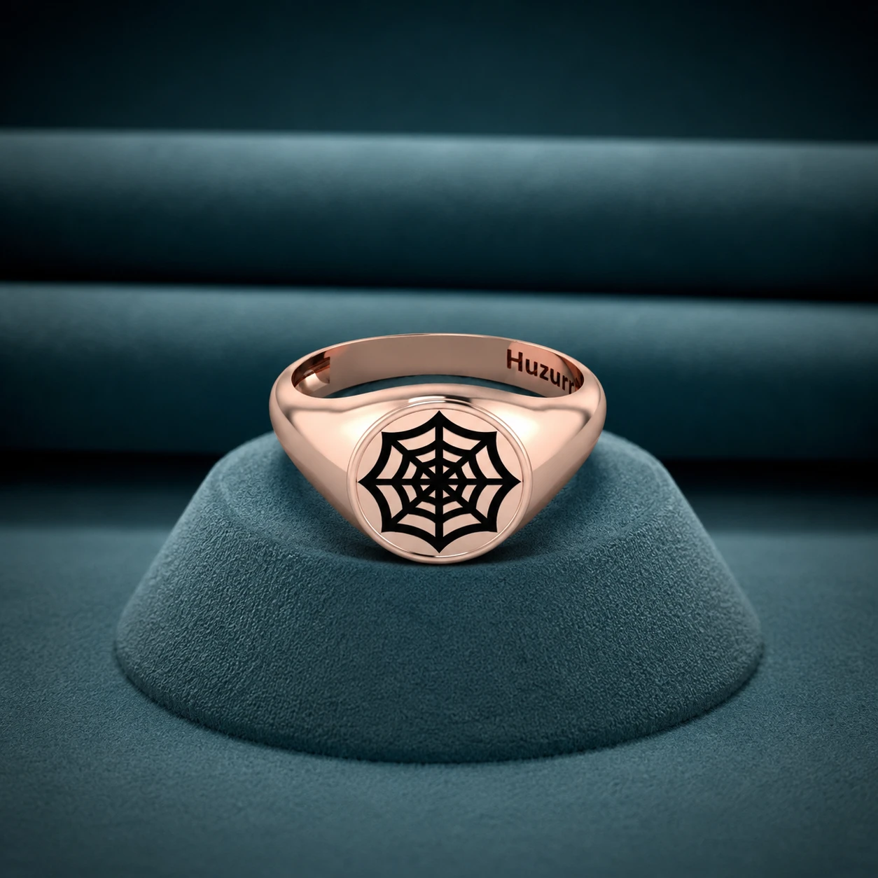 Men's rose gold plated signet ring featuring a black engraved spider web design on a round face.