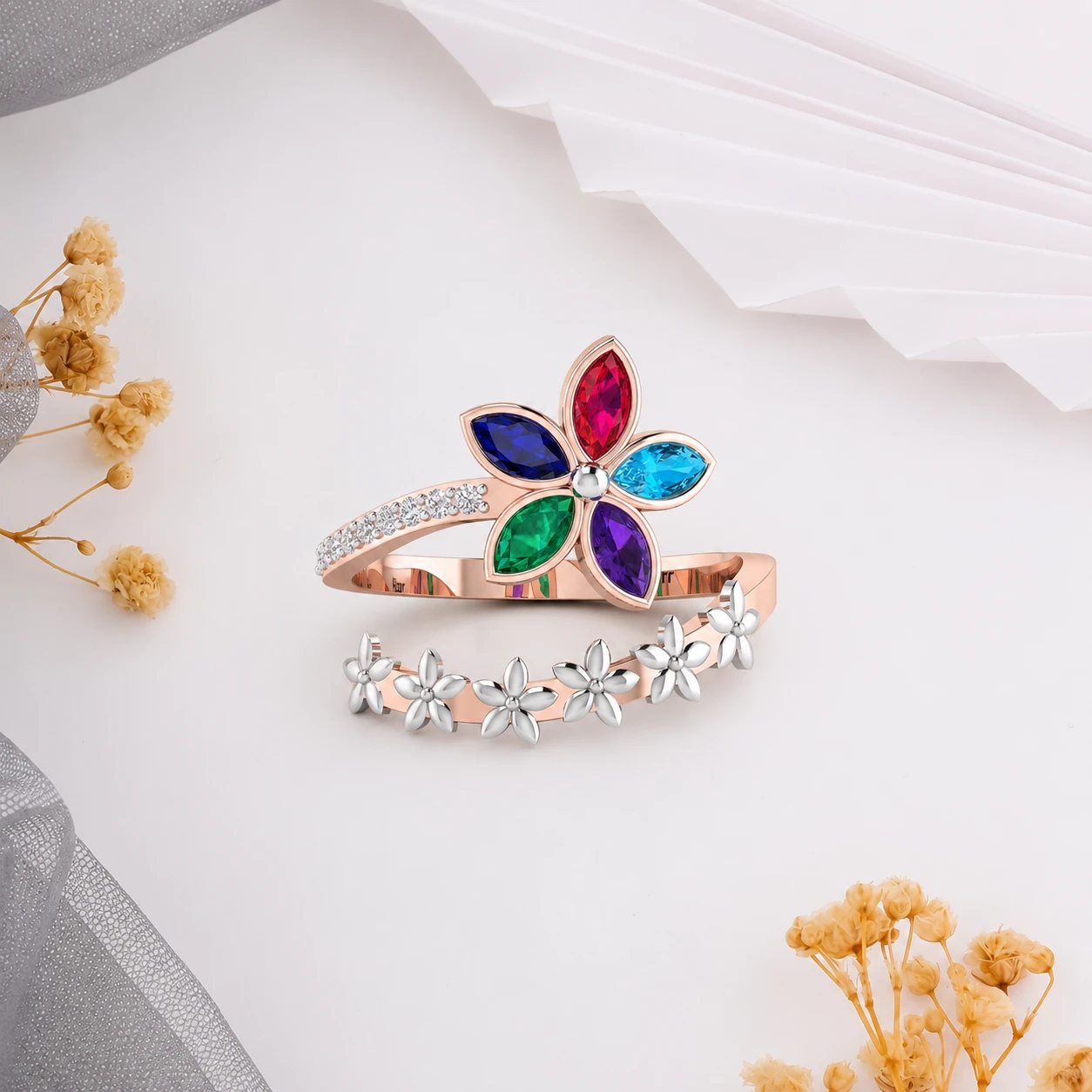 Colorful flower gemstone bypass ring in rose gold plating with small silver blossoms and diamond accents