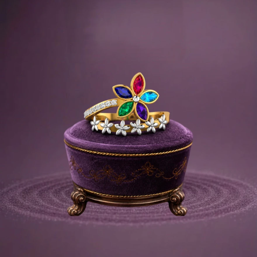 An adjustable statement ring featuring clusters of gemstones resembling colorful, blooming flowers set on a gold-plated, two-tone shank.
