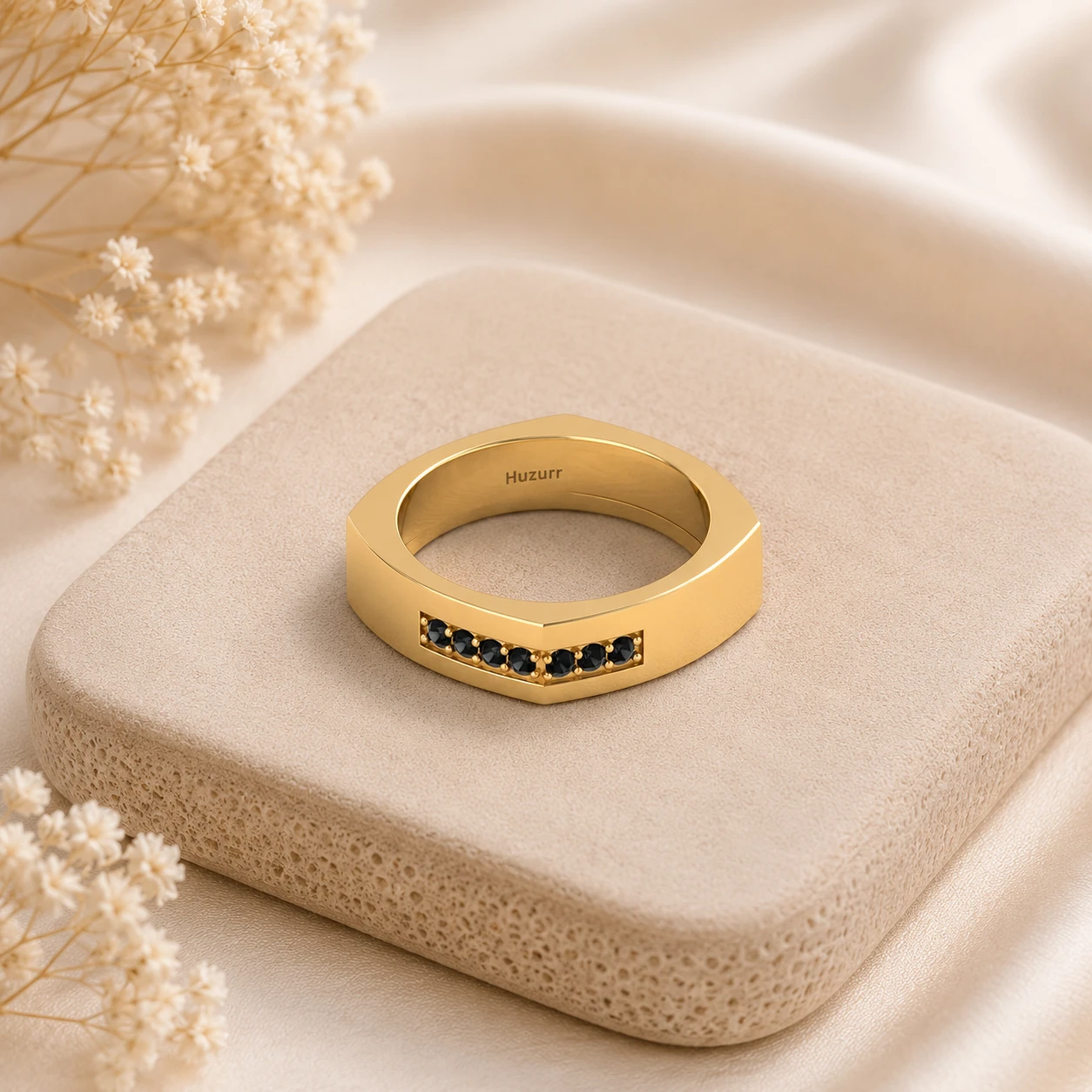 Geometric yellow gold square band ring featuring channel set round black diamonds