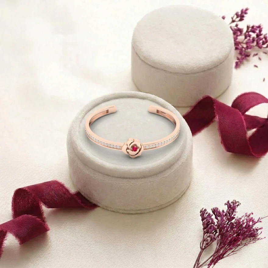 Rose gold plated cuff bracelet with a ruby rose flower center and diamond accents