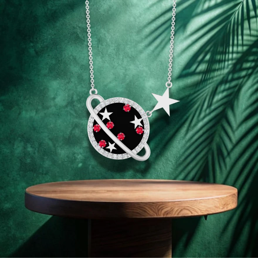Saturn planet necklace in silver with black enamel, rubies, stars, and a diamond dalo