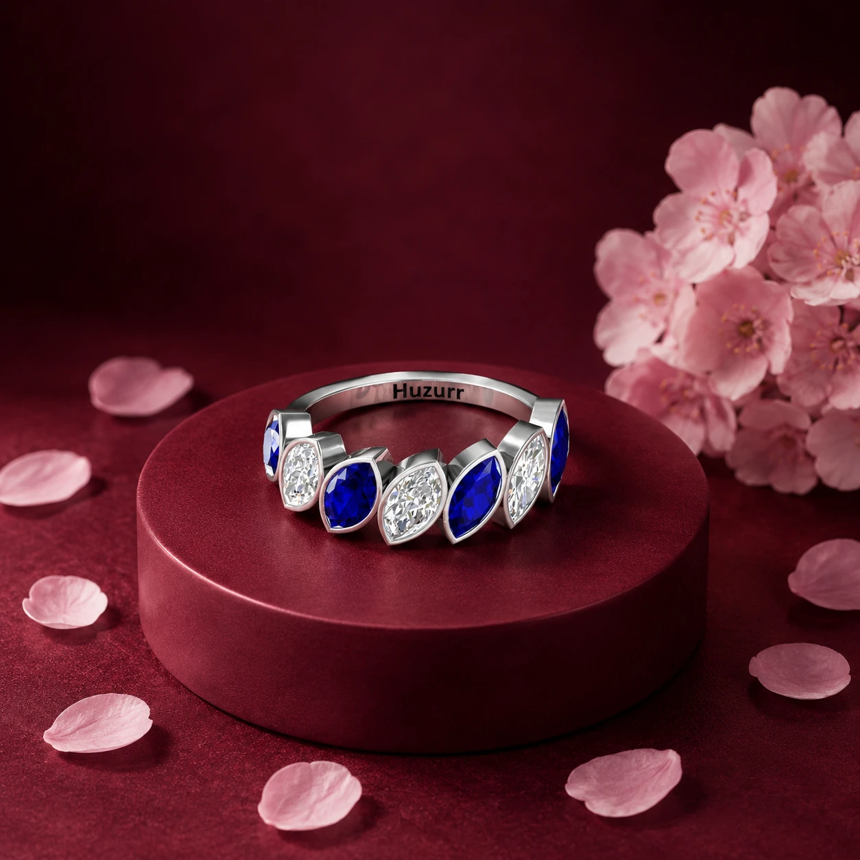 Eternity wedding band in sterling silver set with alternating marquise blue sapphires and round accent diamonds