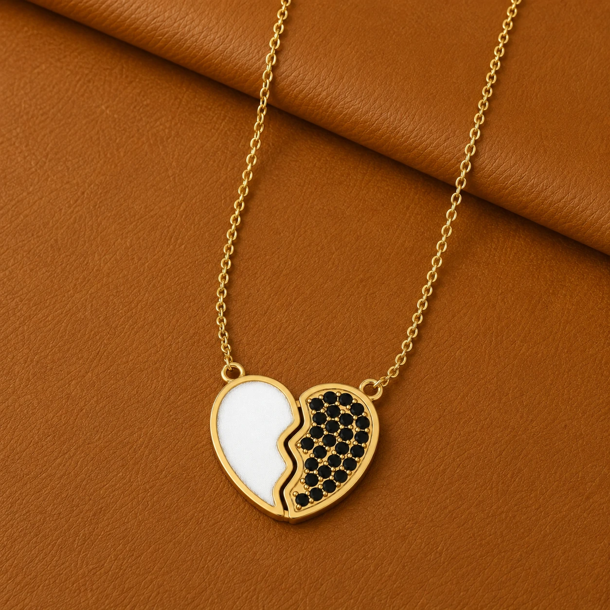 Split heart pendant necklace featuring one half white enamel and one half pave black diamonds in gold fill.