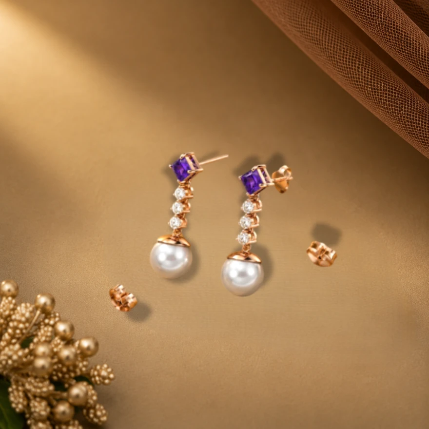 Rose gold plated linear drop earrings have a square amethyst attached to a row of round diamonds with a dangling white pearl.