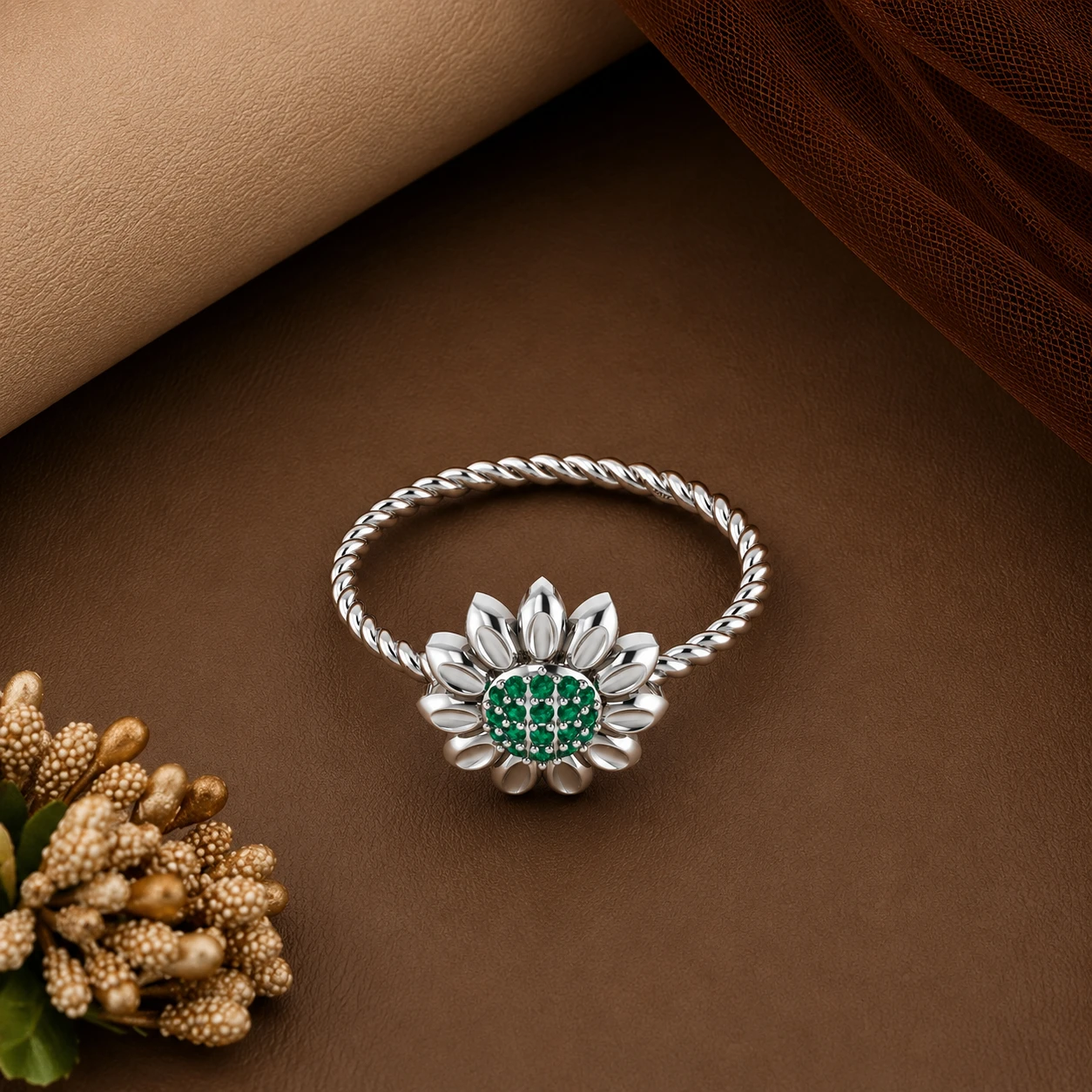 Nature-inspired sunflower twist band ring crafted in bright 925 silver featuring a vivid green emerald stone setting