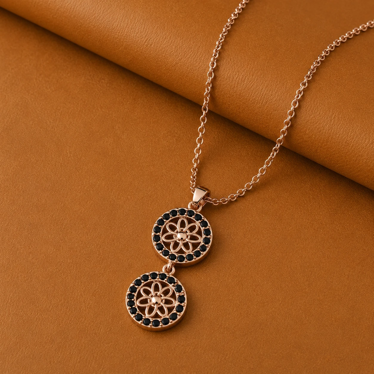Double round geometric sunflower drop pendant necklace framed with tiny black diamonds in rose gold plating.